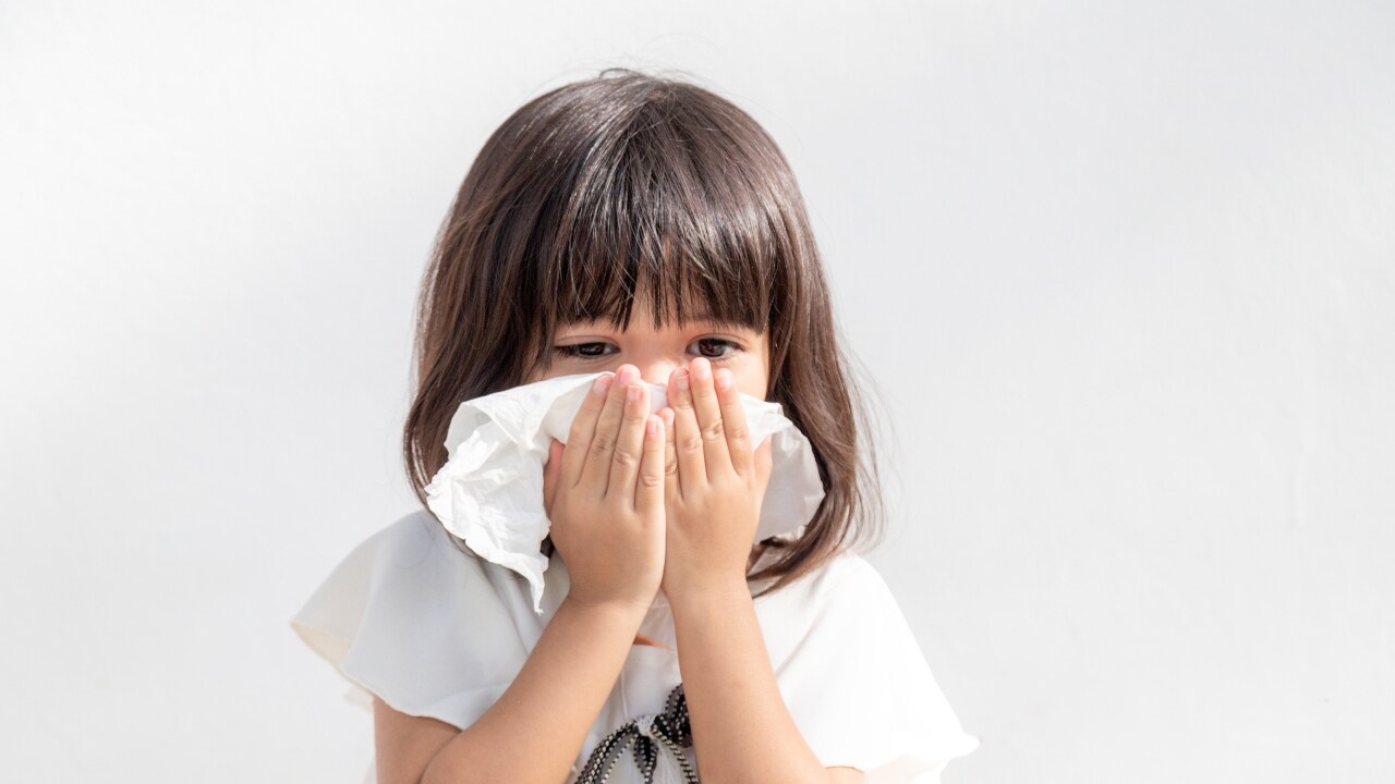 child with a tissue