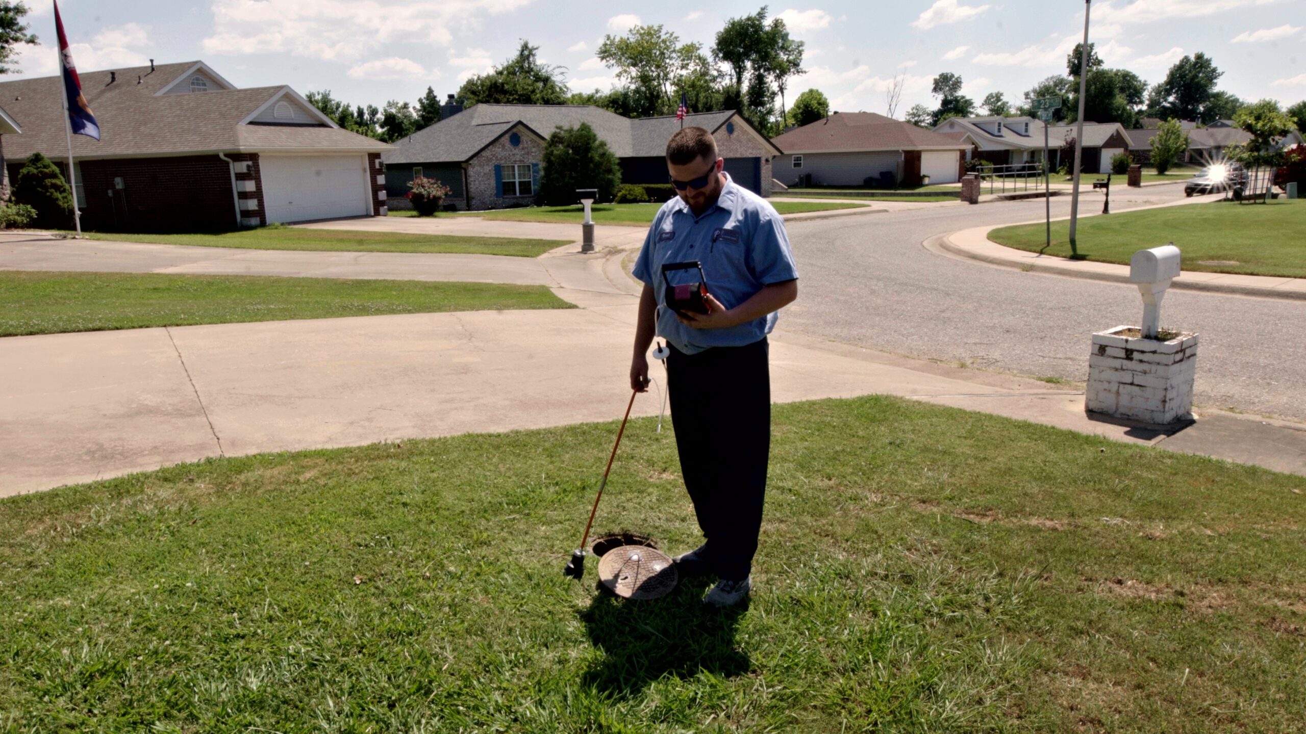 Paschal technician reviewing readings on a leak detection monitor to pinpoint a water leak in Bentonville