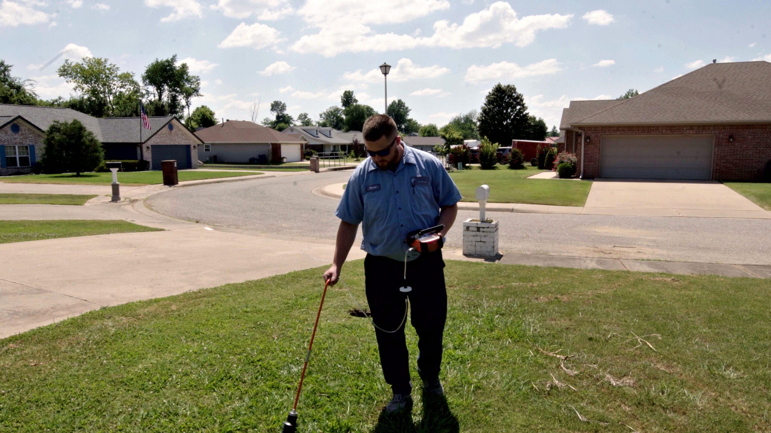 Paschal technician arriving with acoustic leak detection equipment at a Fayetteville home